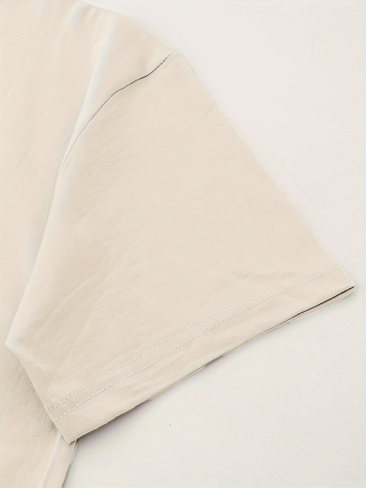 Close-up of the sleeve of a Retro Country Music Festival T-Shirt, showcasing the crew neck and cotton fabric.