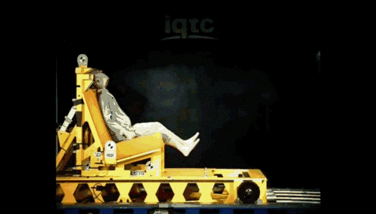 Crash test dummy in a baby car seat safety test, demonstrating effectiveness for child seats.