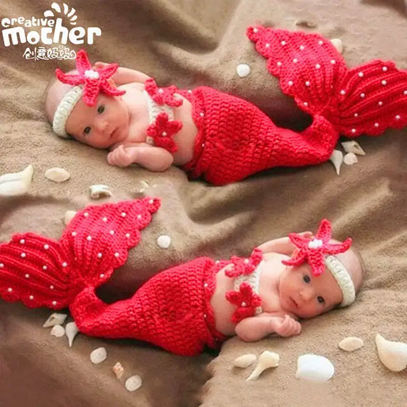 Adorable baby in a red crochet mermaid costume with starfish headband, perfect for ages 0-6 months.