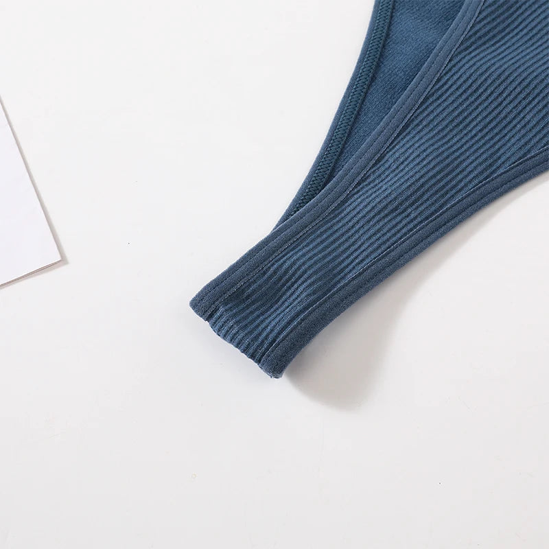 Detail of MonoSculpt™ One-Shoulder Seamless Crop Top in blue, showcasing ribbed texture and high-quality fabric.