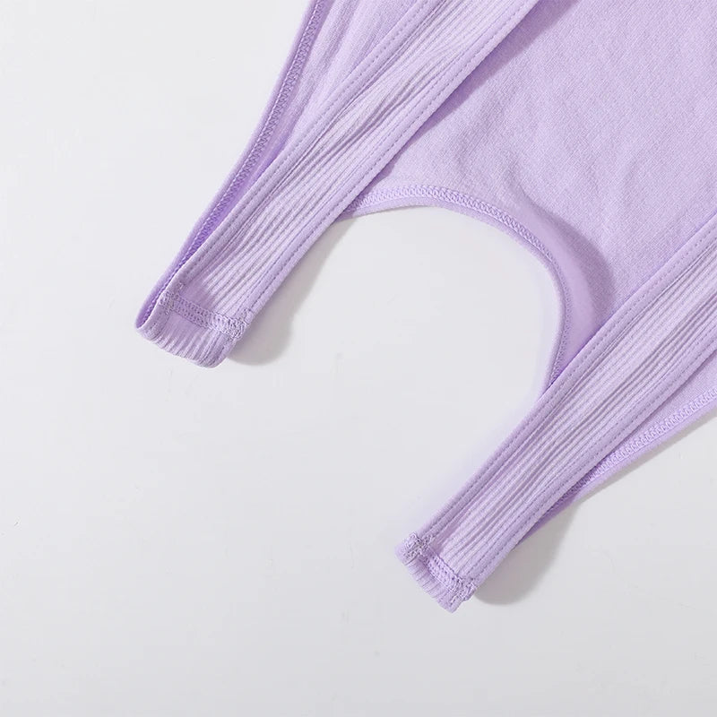 Close-up of the ribbed straps of a lavender seamless crop top, highlighting its soft knit material and design.