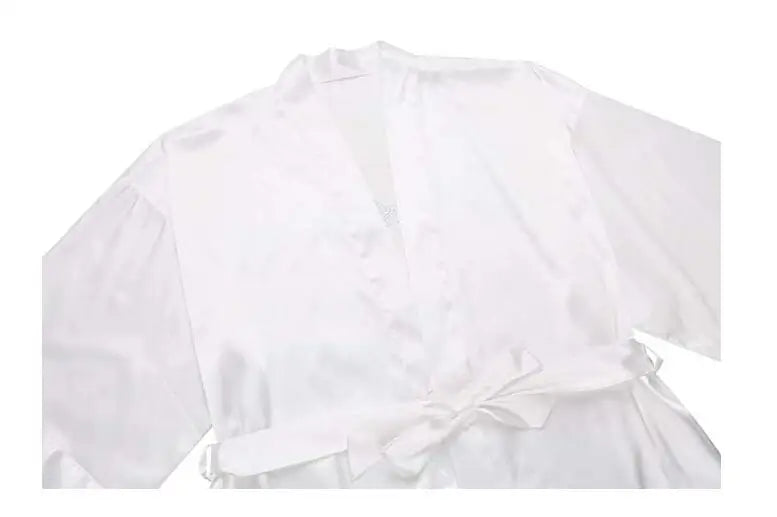 Elegant white satin bridesmaid robe with a tied waist, perfect for wedding day preparations.