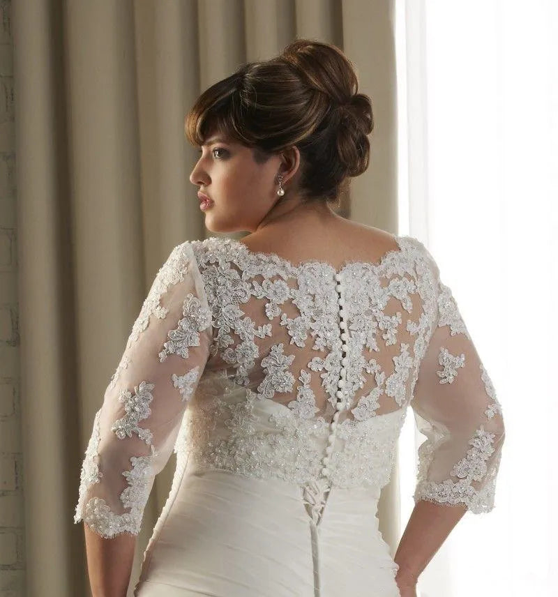 Elegant bride in a Crystal Lace Wedding Bolero with 3/4 sleeves, showcasing intricate floral appliqué details.