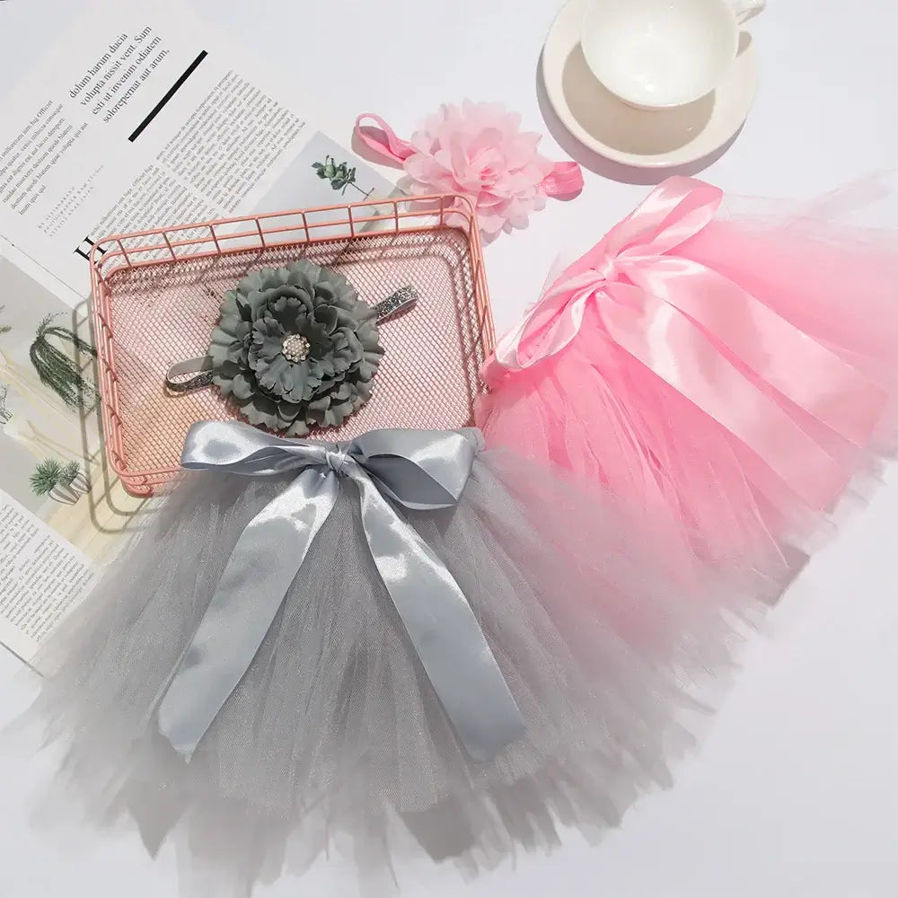 Infant suit headband set including pink and gray tutu skirts with flower headband, perfect for baby girls photography.
