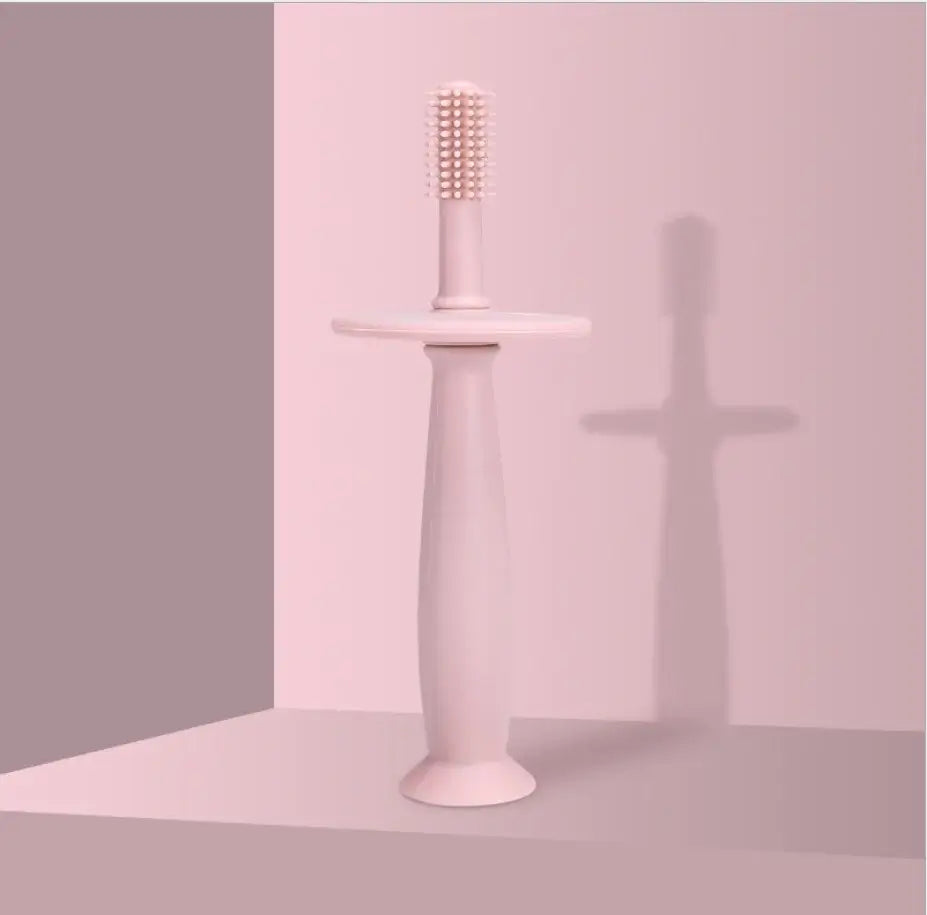 1PC Baby Soft Silicone Training Toothbrush designed for infants, featuring a solid pink color and safety-focused design.