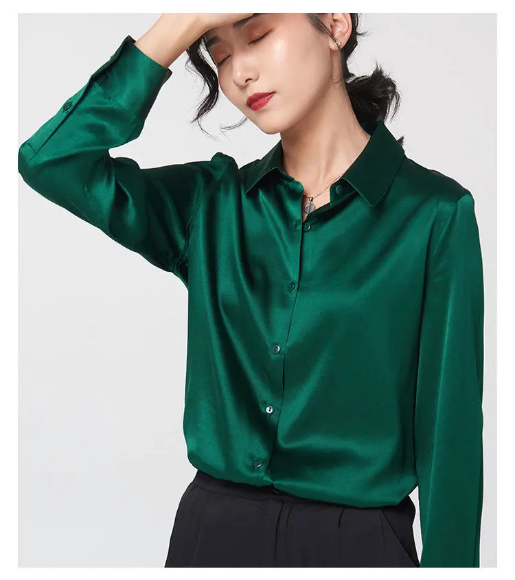 Model showcasing a green satin long sleeve silk shirt with a V-neck and single-breasted closure.
