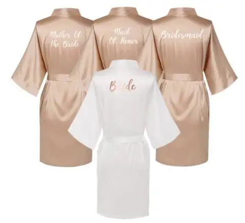 Rose gold satin bridal party robes for Mother of the Bride, Maid of Honor, Bridesmaid, and Bride.