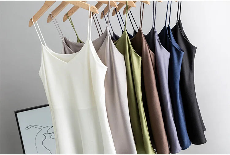 BandeauSilk™ double-layer silk camisoles in various colors displayed on hangers, showcasing summer fashion.