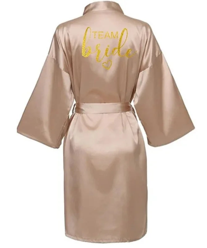 Team Bride gold letter satin kimono robe in soft beige, perfect for bridesmaids and bridal parties.