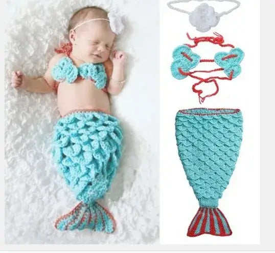 Cute baby girl in a turquoise mermaid costume with floral headband, ideal for ages 0-6 months, unisex design.