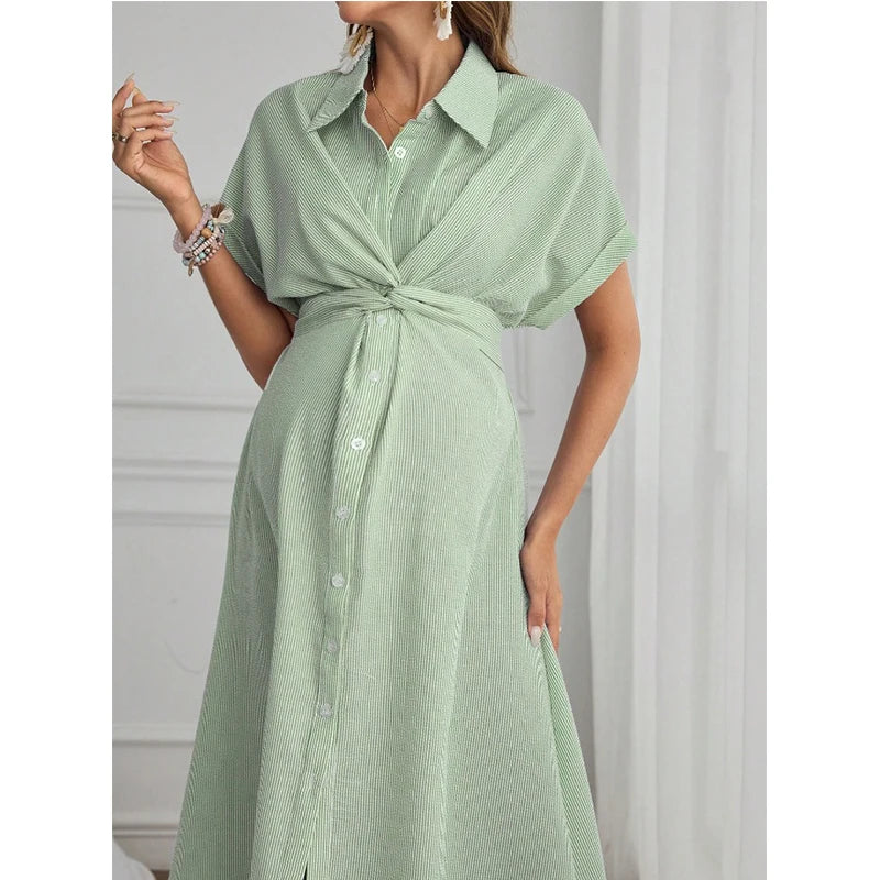 Light green striped short sleeve maternity shirt dress with a tie front, perfect for casual summer outings.