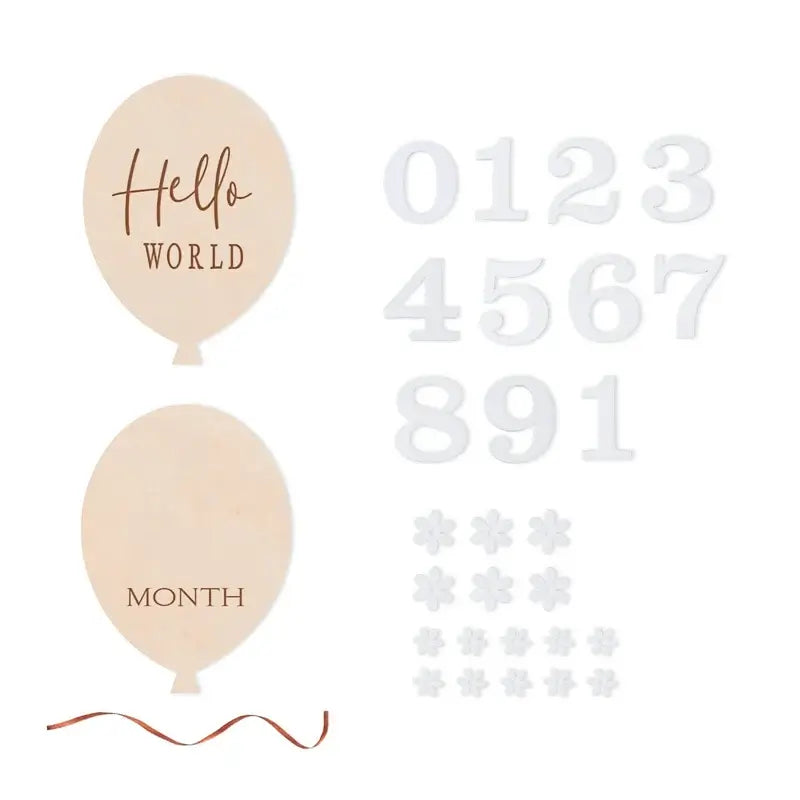 Wooden baby flower shape milestone set with balloons, numbers, and floral decor for capturing memories.