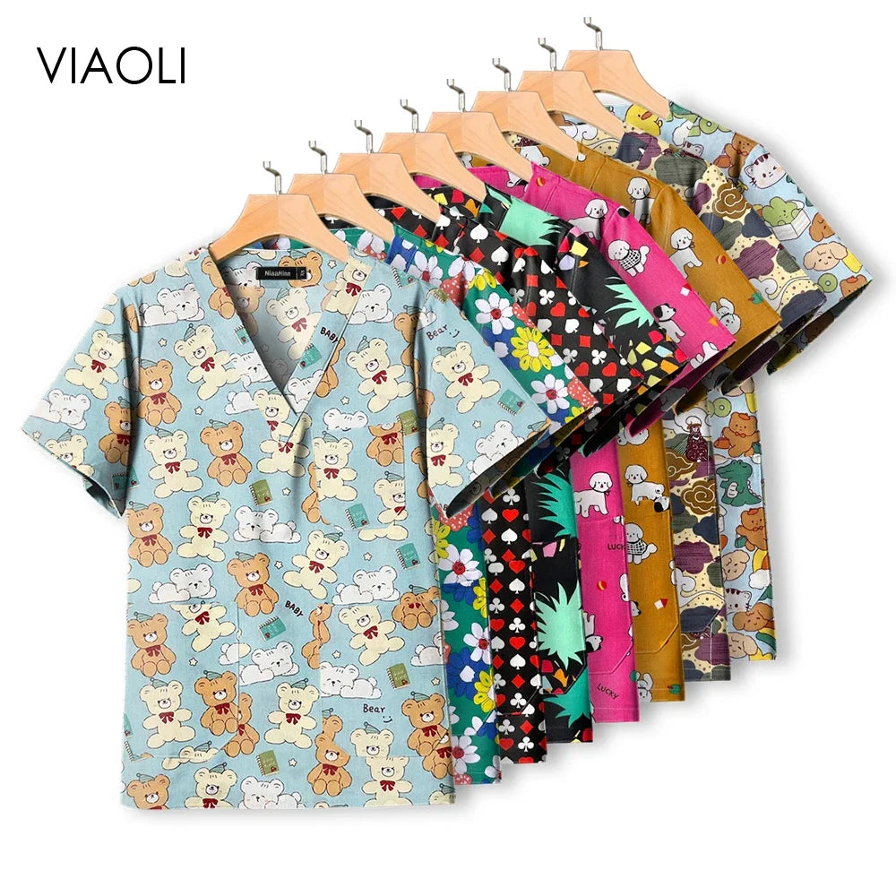 Colorful pediatric nursing scrub tops by VIAOLI featuring fun animal and floral patterns, perfect for healthcare professionals.