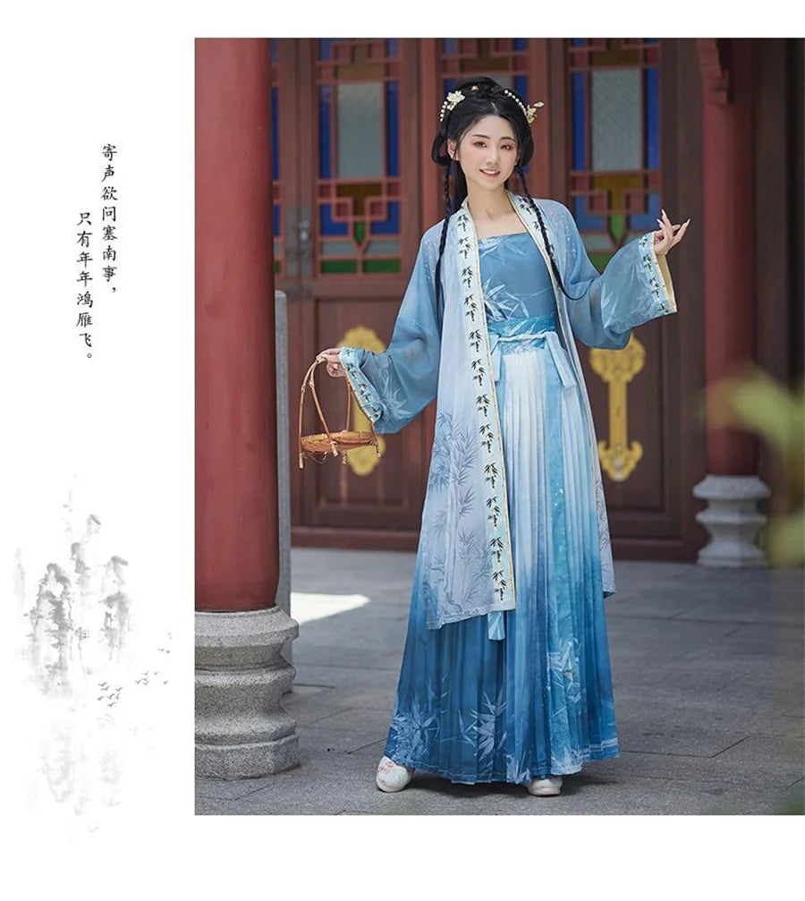 Elegant woman in blue Hanfu cosplay dress, showcasing traditional Chinese fashion in a serene outdoor setting.