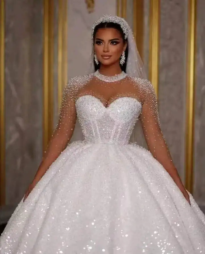 Sparkle African wedding ball gown with glitter beads, sweetheart neckline, and elegant lace-up back design.