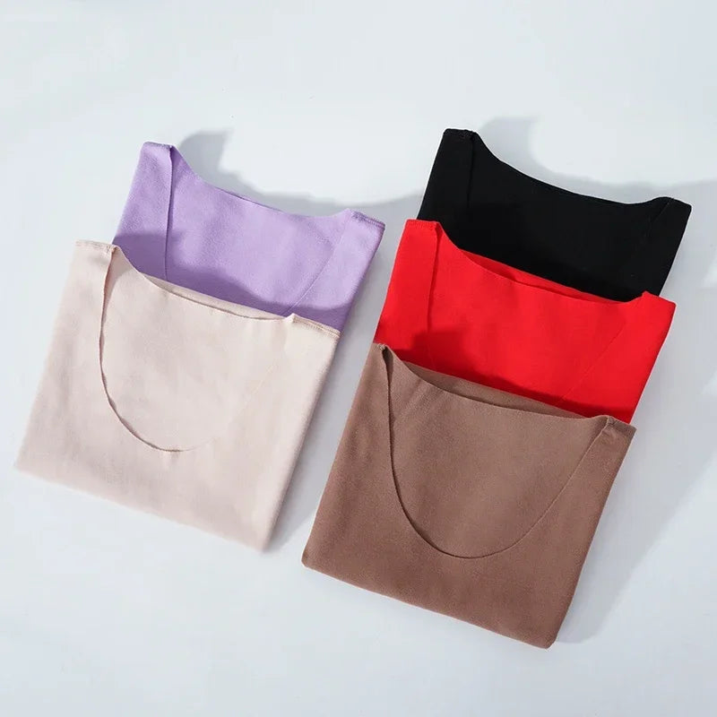 Colorful collection of HeatHold™ Thermal Slim Inner Vests in purple, black, red, beige, and brown for winter layering.
