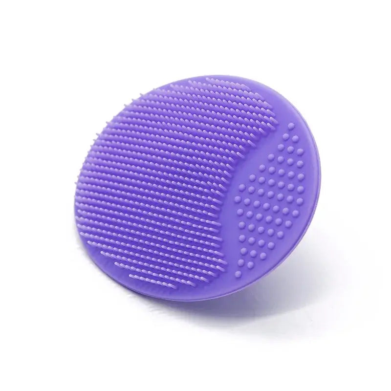 Purple silicone baby bath brush designed for gentle cleansing and shampoo application for newborns and infants.