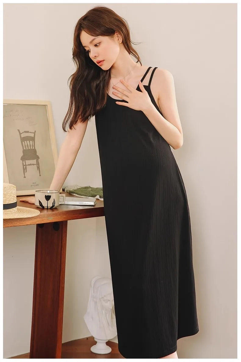 Sleeveless strap maternity dress in black, perfect for summer outdoor wear, showcasing casual A-line silhouette.