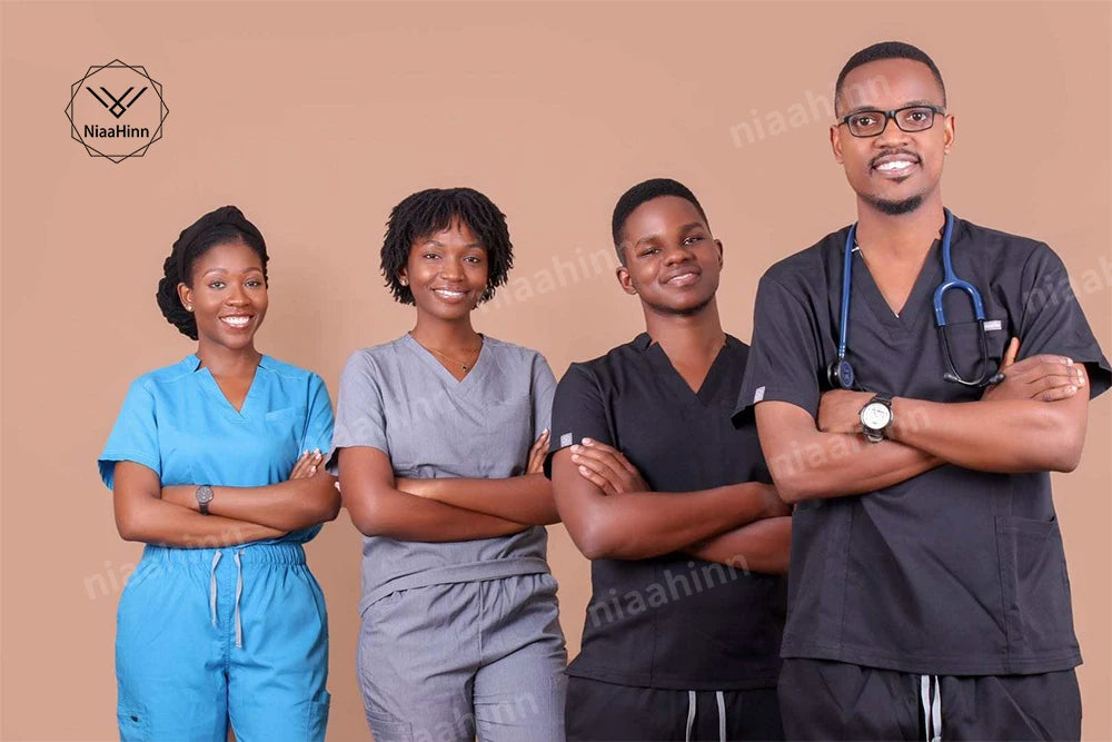 Diverse healthcare professionals in NiaaHinn scrubs, showcasing short sleeve tops for nurses in a professional setting.