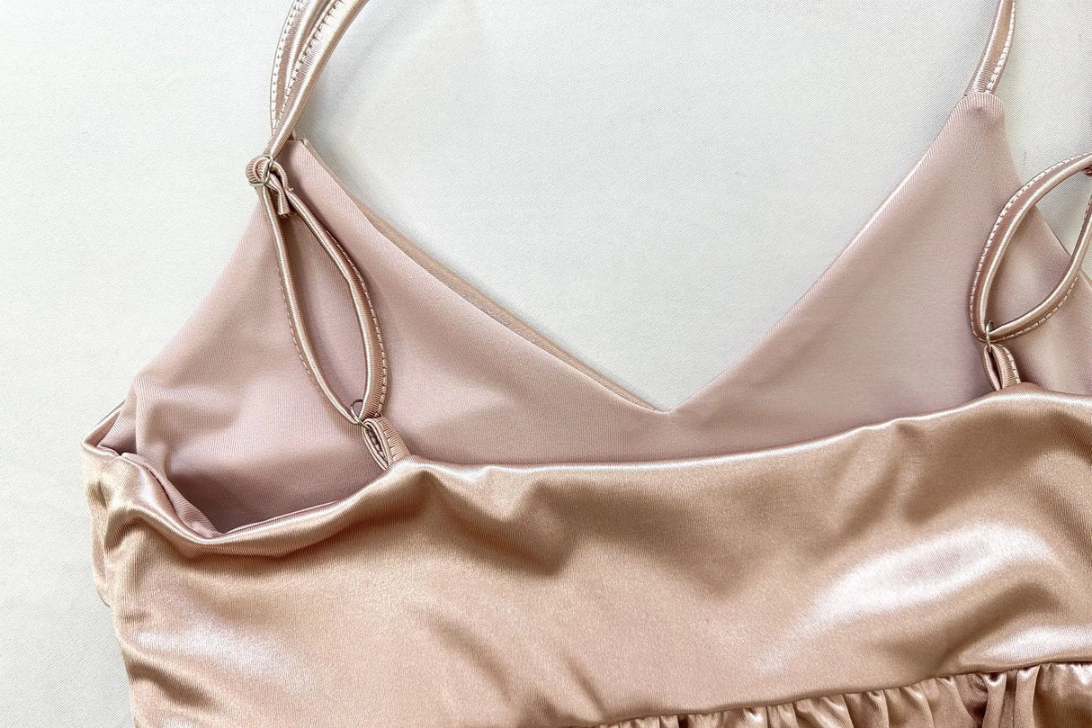 Close-up of a Ruffle Strap V-Neck Backless Crop Top in soft fabric, highlighting the delicate straps and flattering neckline.