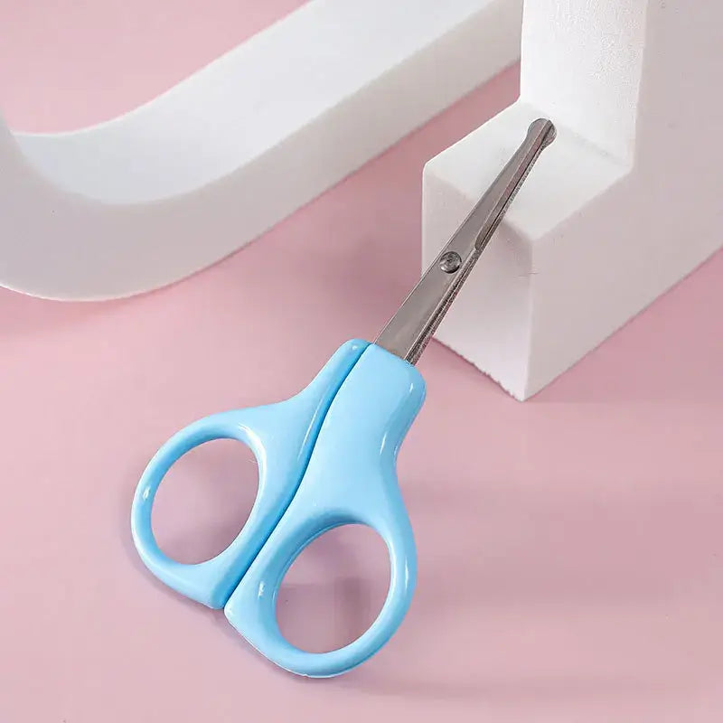 Light blue baby nail scissors designed for newborn care, ideal for trimming tiny nails safely.