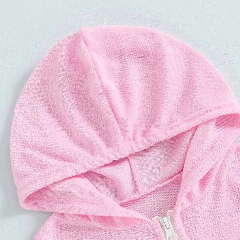 Close-up of a pink hooded zipper detail for toddler girls' short sleeve dress.