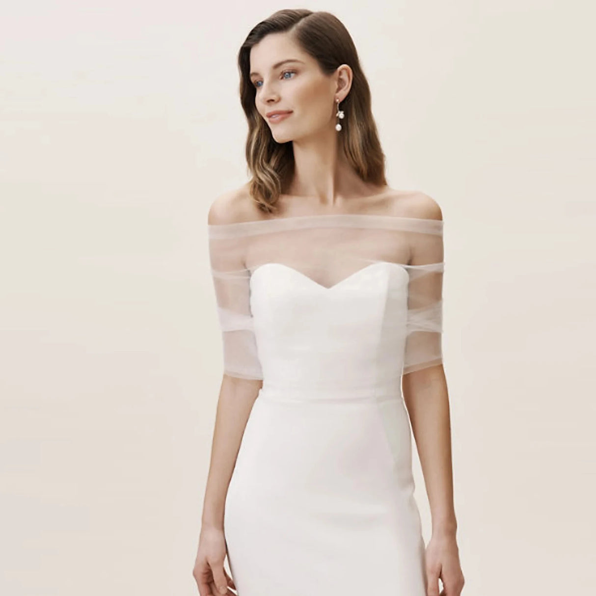 Model wearing VG73 sheer wedding jacket bolero over elegant bridal gown, showcasing a romantic and modern bridal style.