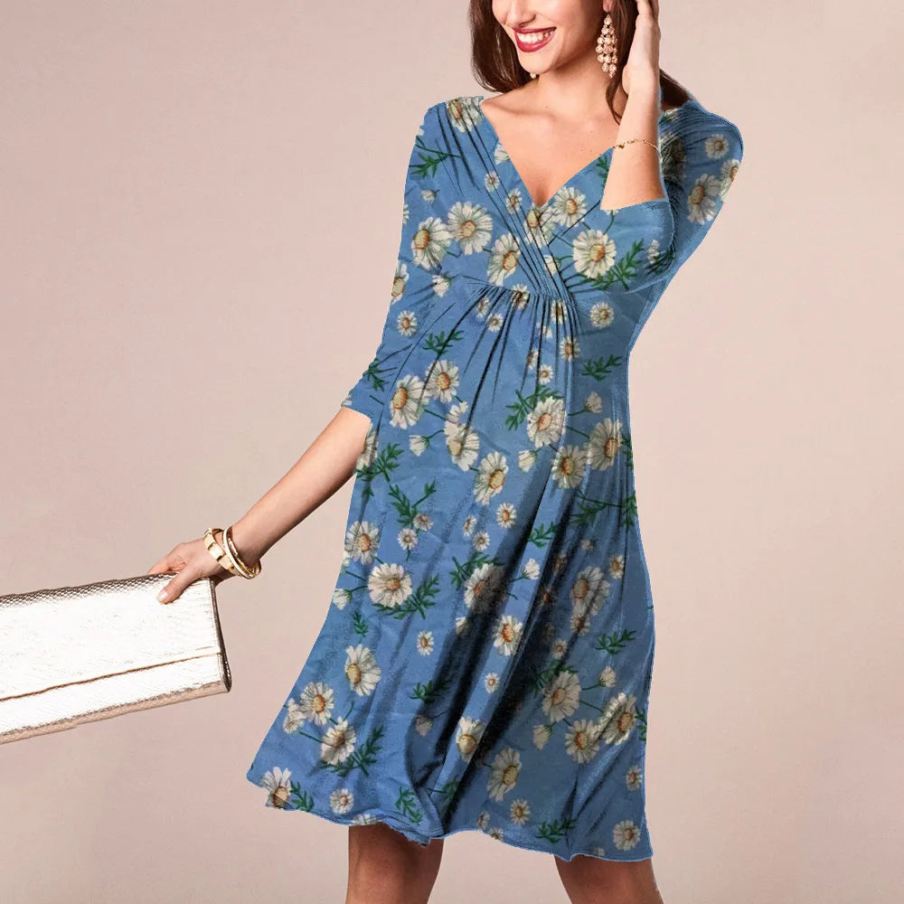 Woman in a blue floral dress, showcasing a V-neck design and knee-length silhouette, ideal for summer nursing wear.