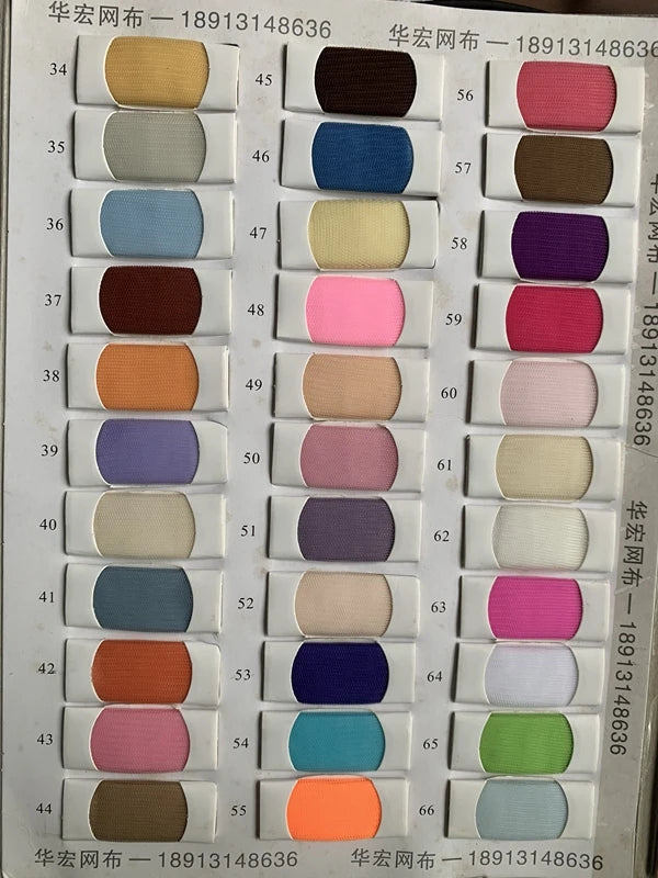 Color swatch chart showcasing a variety of fabric options including shades of pink, blue, purple, and neutral tones.