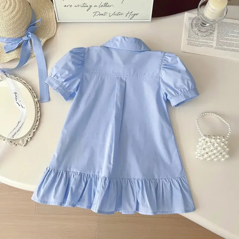 Knee-length blue summer dress for girls with turn-down collar and ruched sleeves, perfect for kids aged 4-6 years.