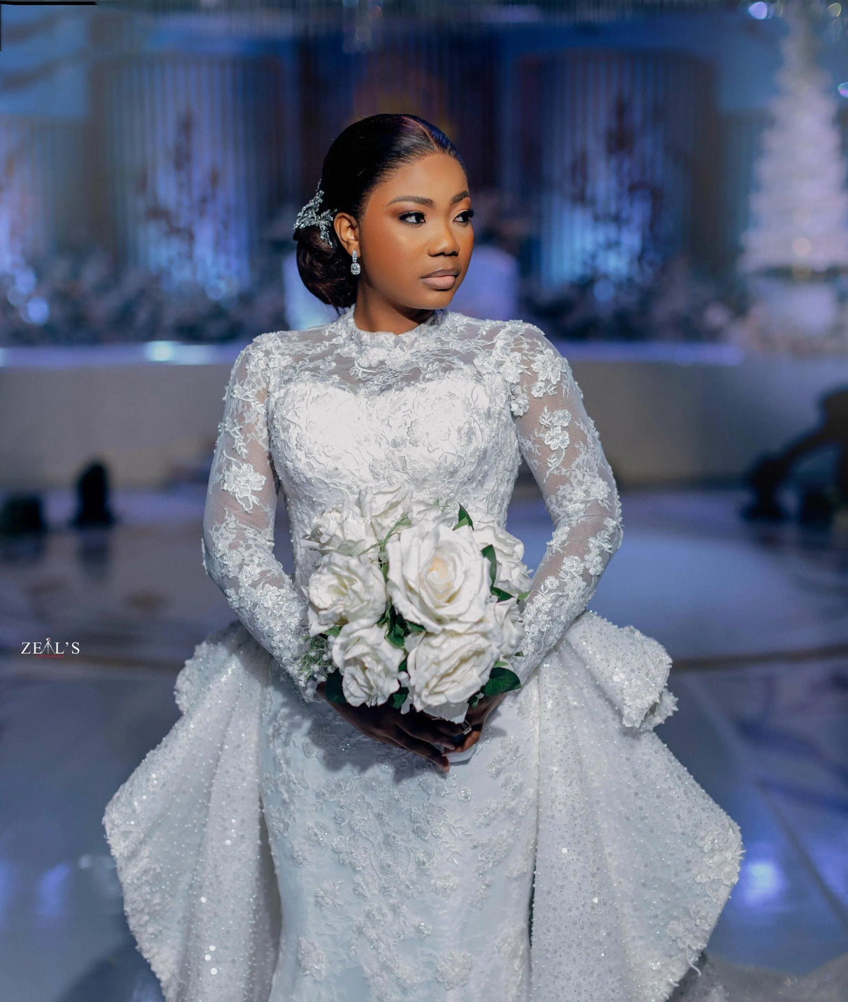 Aso Ebi Mermaid Wedding Dress with Detachable Train, featuring lace appliques and a bride holding white roses.