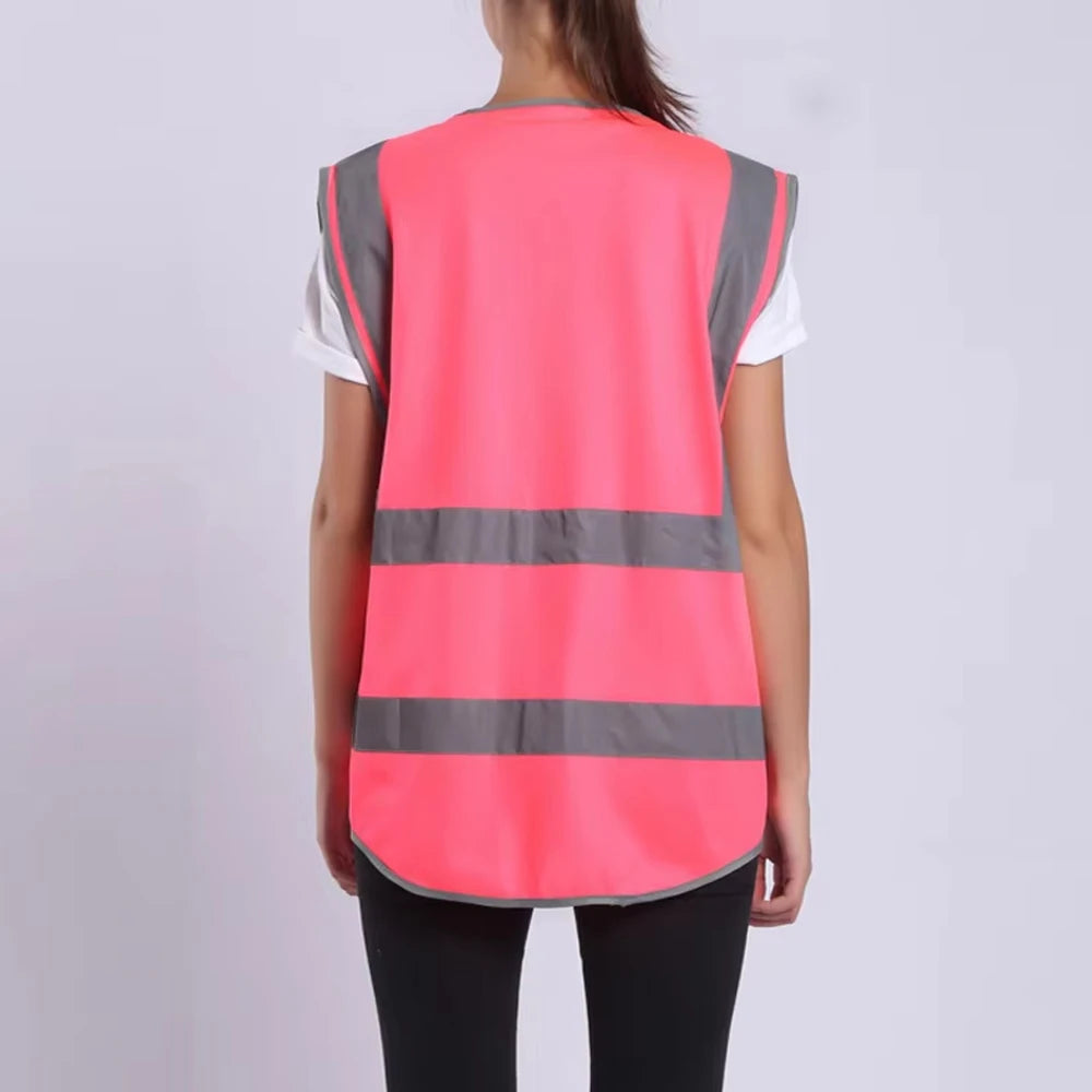Hi-Vis pink safety vest with reflective stripes, designed for unisex workwear in construction and outdoor environments.