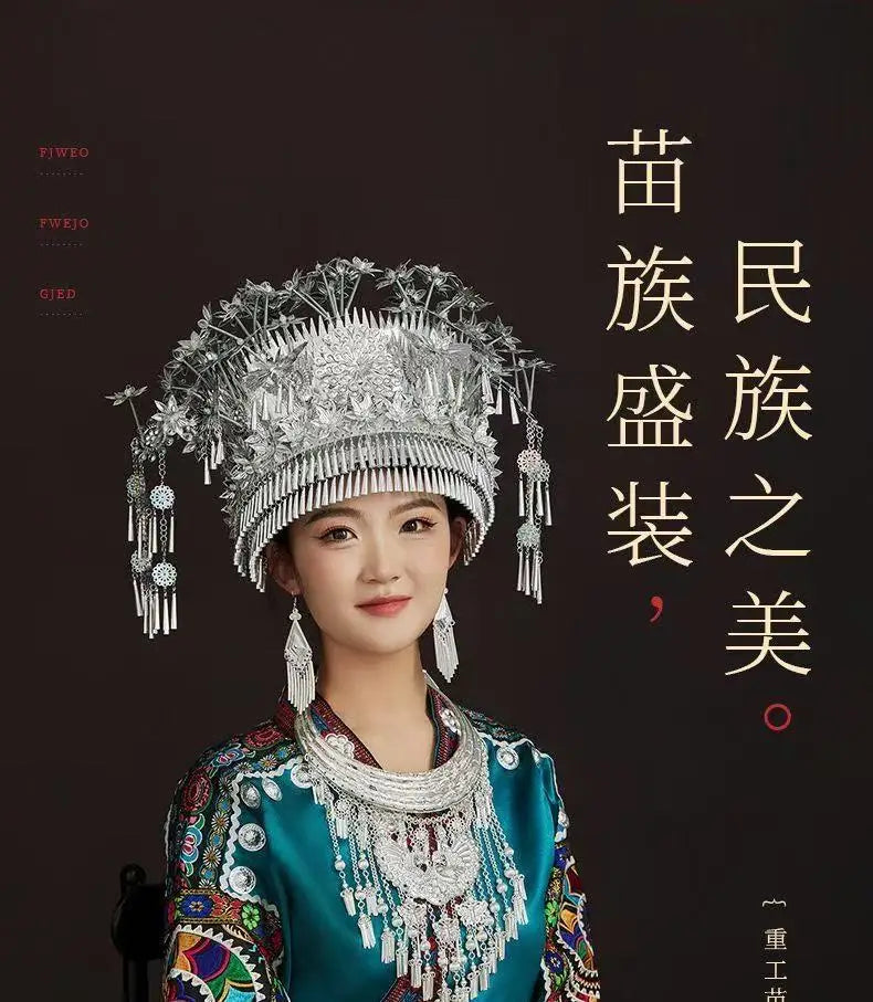 Women wearing traditional Miao embroidery suit with elaborate silver accessories, showcasing festival costume elegance.