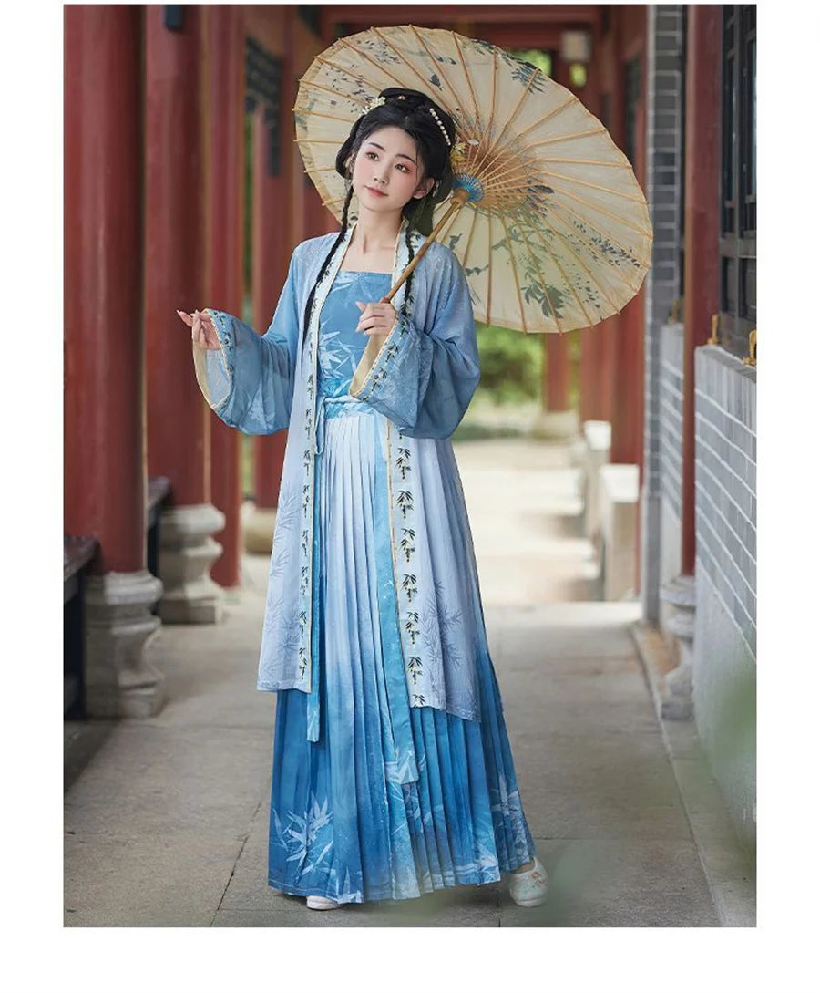 Women’s Hanfu cosplay in blue dress holding a parasol, showcasing traditional Chinese attire beauty and elegance.