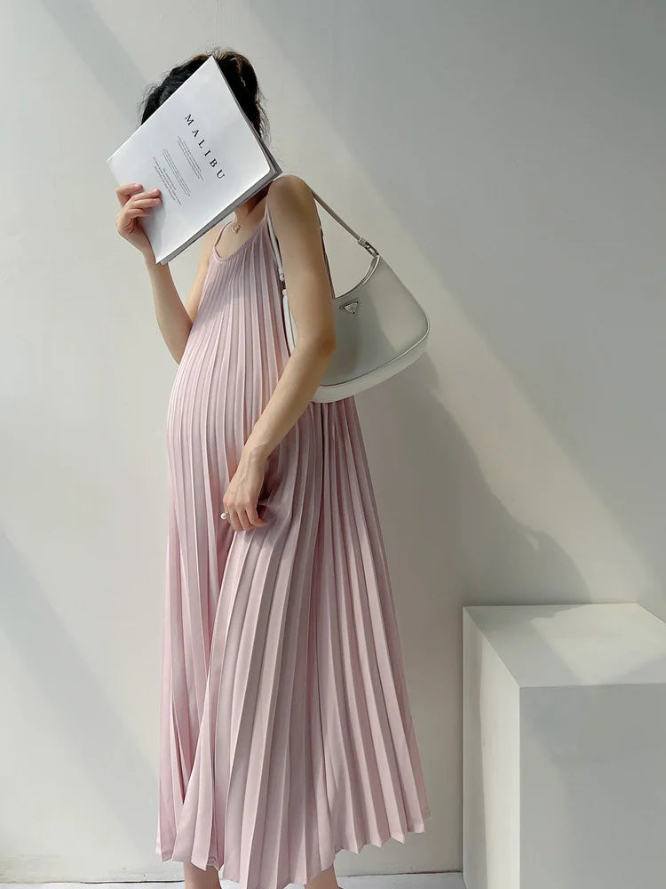 Pleated chiffon maternity dress in soft pink, mid-calf length, perfect for summer days.