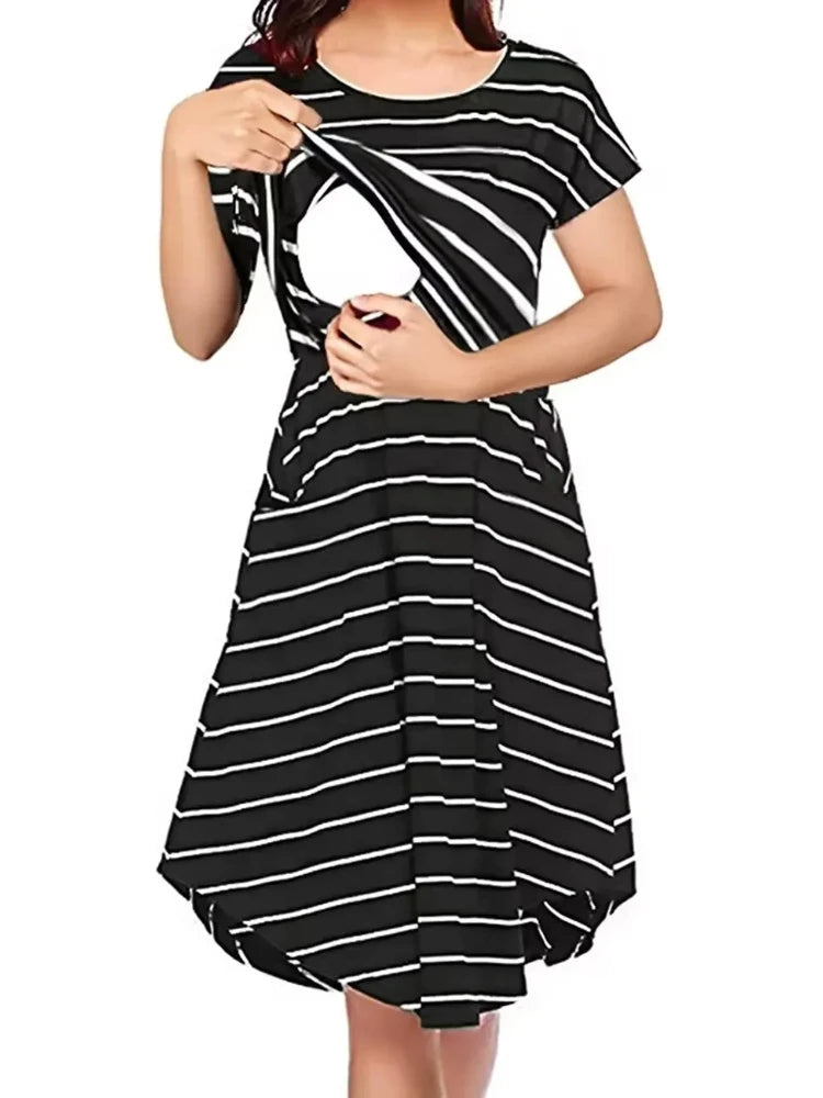 Striped multifunctional nursing dress in black and white, ideal for maternity and breastfeeding, featuring a boat neck and A-line silhouette.