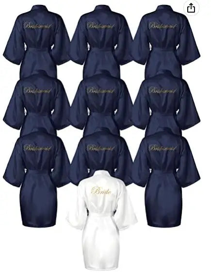 Collection of navy satin robes with 'Bridesmaid' text and a white robe labeled 'Bride' for wedding festivities.