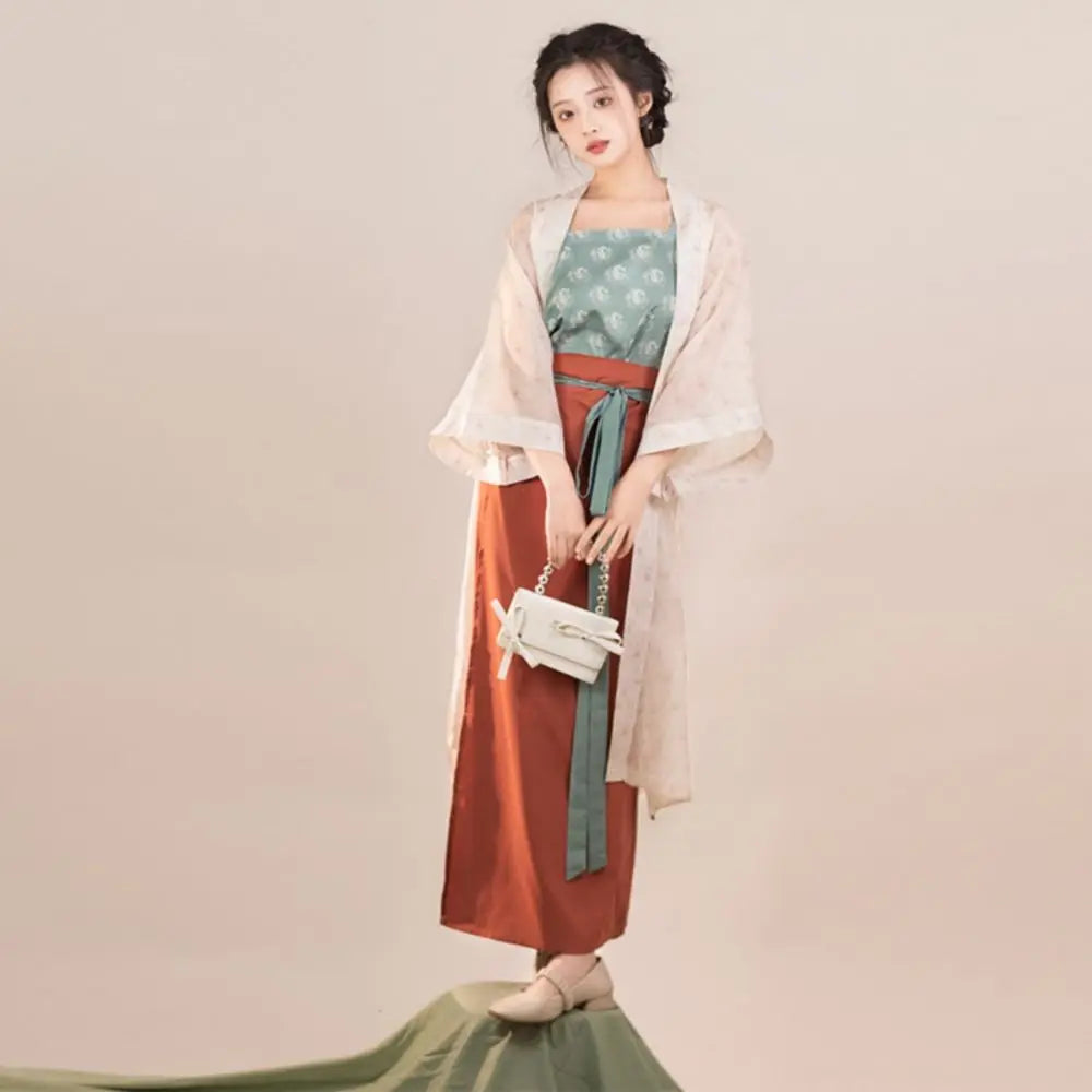 Song Dynasty Hanfu three-piece outfit for women featuring a floral top, flowing skirt, and elegant cover-up.