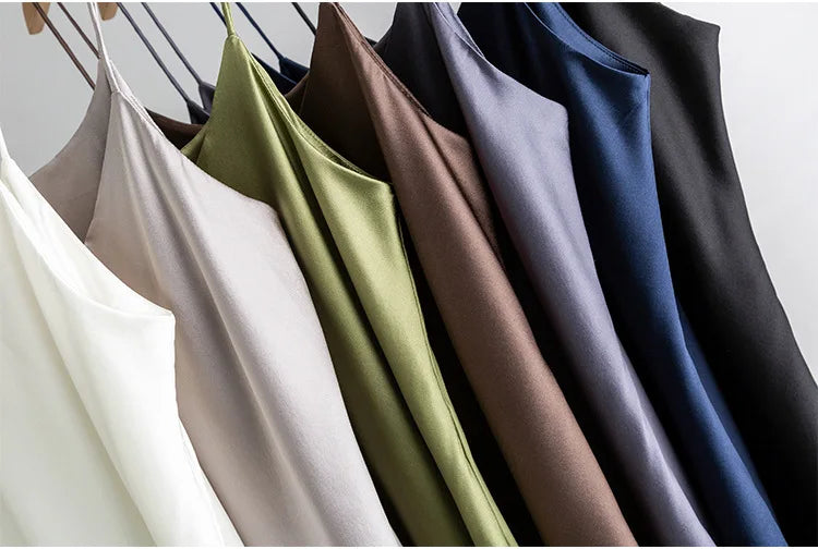 Assorted colors of BandeauSilk™ double-layer silk camisoles hanging, showcasing summer styles for women.