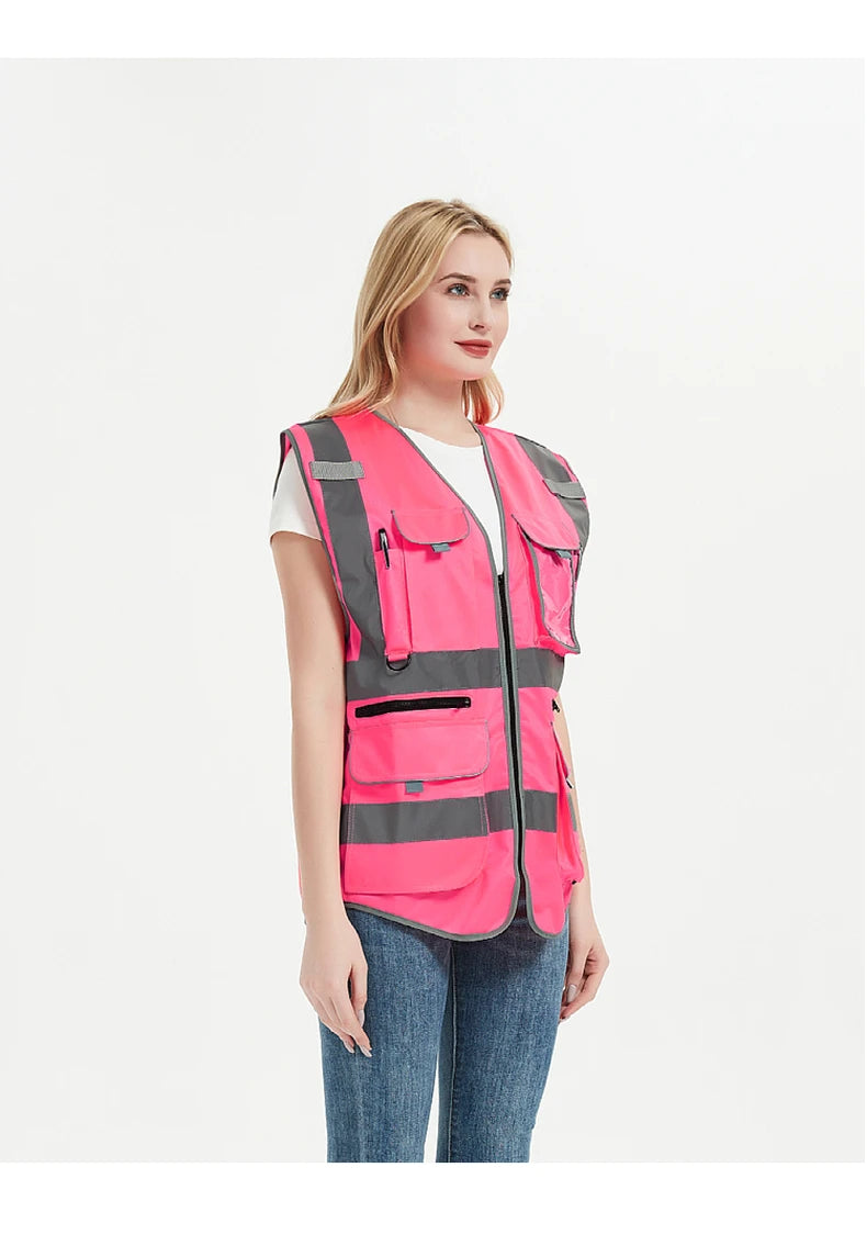 High visibility pink safety vest for women with reflective tape, designed for work uniforms and outdoor activities.
