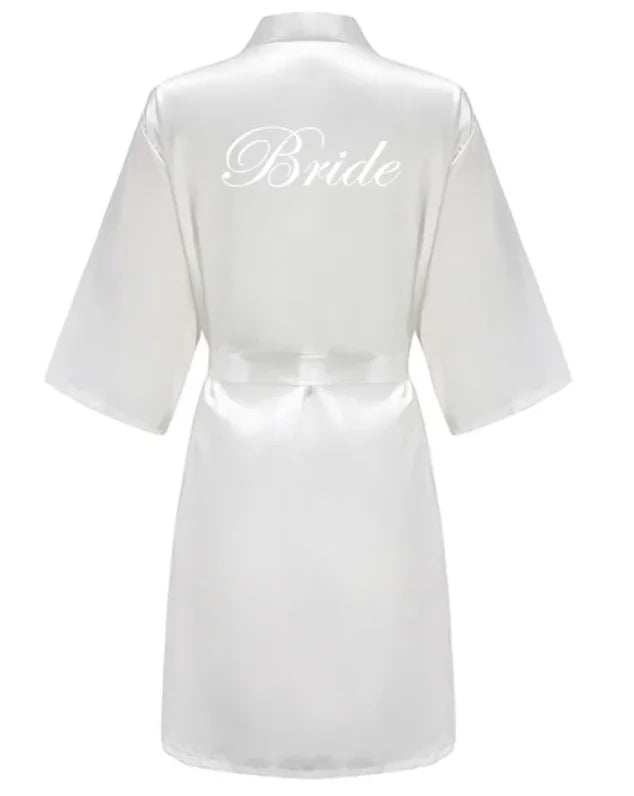 Back view of a white satin robe with 'Bride' printed in elegant script, ideal for bridal parties.