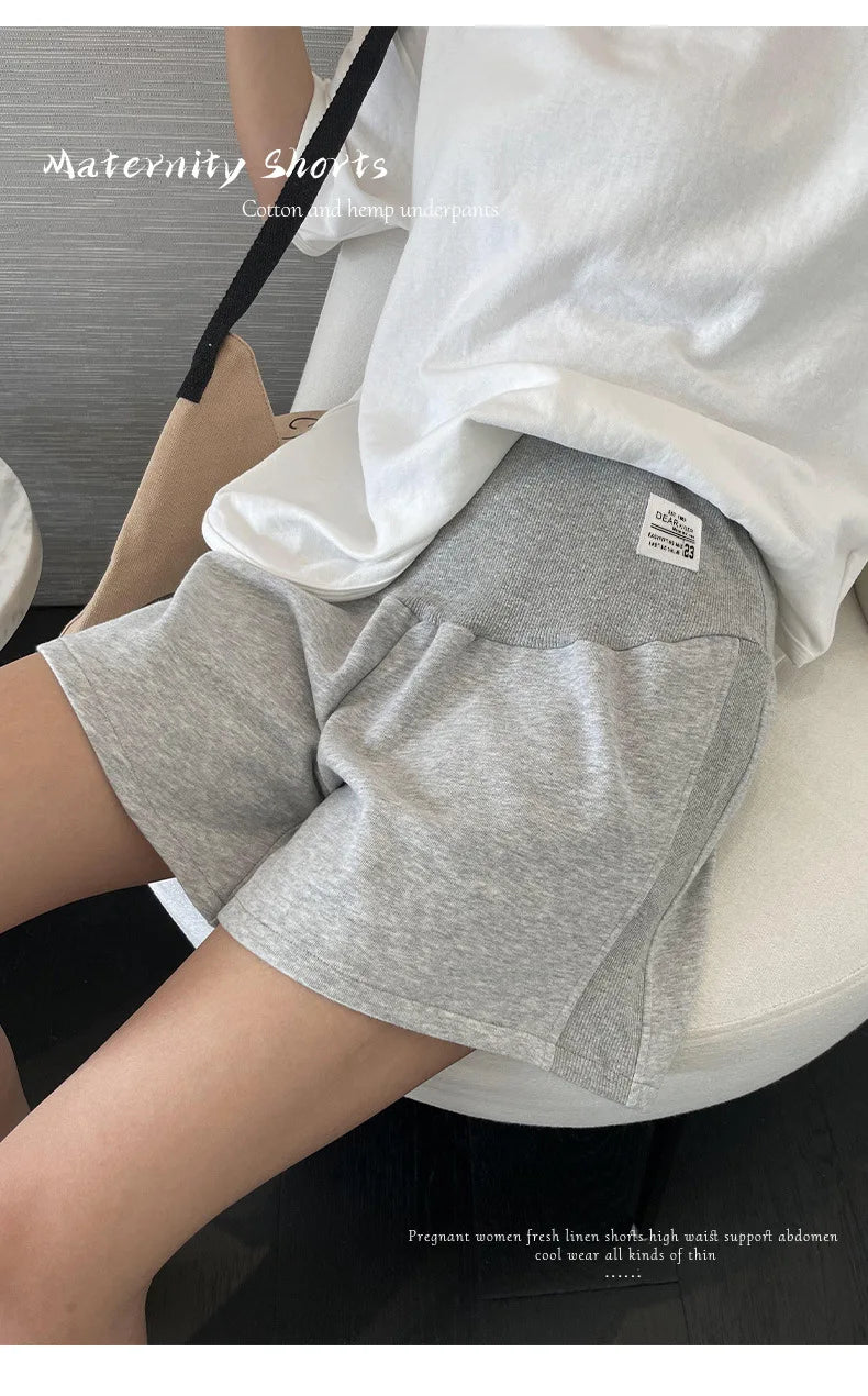 Plus size adjustable maternity shorts in comfortable grey fabric, perfect for summer wear and designed for loose fit.
