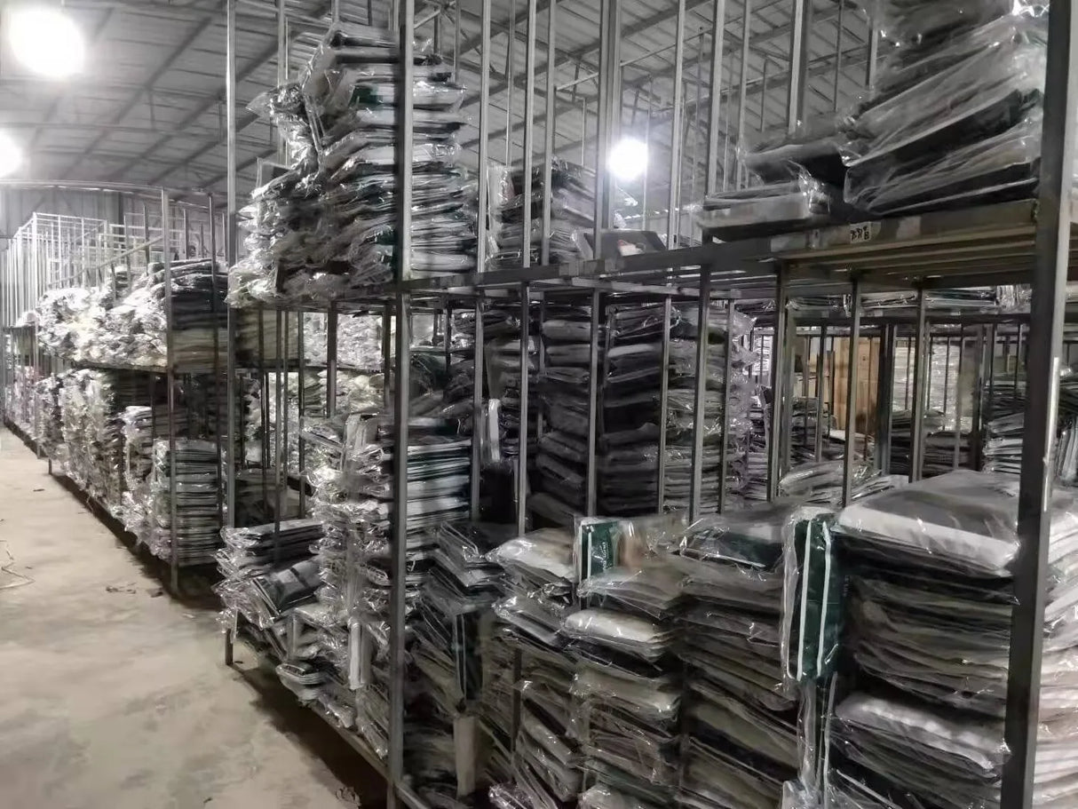 View of a large storage area filled with neatly stacked packages on metal shelves in a warehouse.