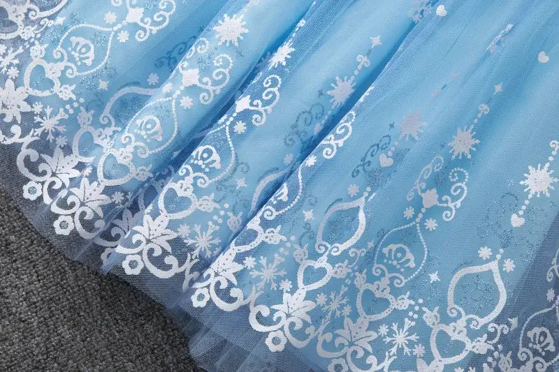 Knee-length blue summer dress for girls featuring a cartoon pattern with hearts and snowflakes, perfect for casual wear.