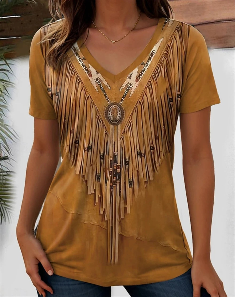 Stylish women's V-neck tee with fringed design and decorative embellishments in mustard color.