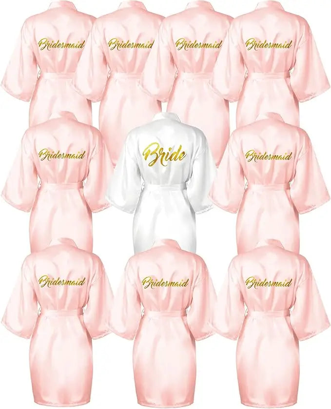 10-piece satin kimono robe set featuring one white "Bride" robe and nine pink "Bridesmaid" robes, ideal for wedding showers.