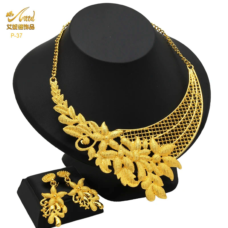 Luxury Indian bridal jewelry necklace set with intricate leaf design, matching earrings, crafted in 24K gold finish.