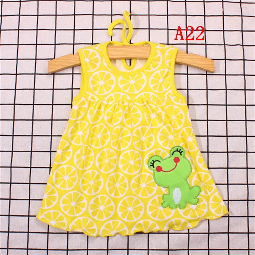 Bright yellow baby dress with lemon pattern and frog applique, perfect for summer wear for infants.