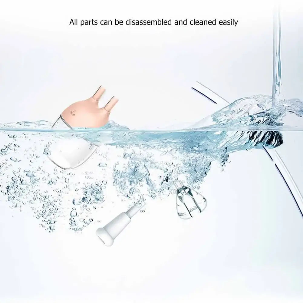 Baby nose cleaner tool disassembled and floating in water, showcasing easy cleaning features.