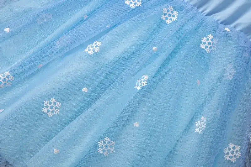 Light blue knee-length dress with snowflake and heart patterns, perfect for girls summer casual wear.